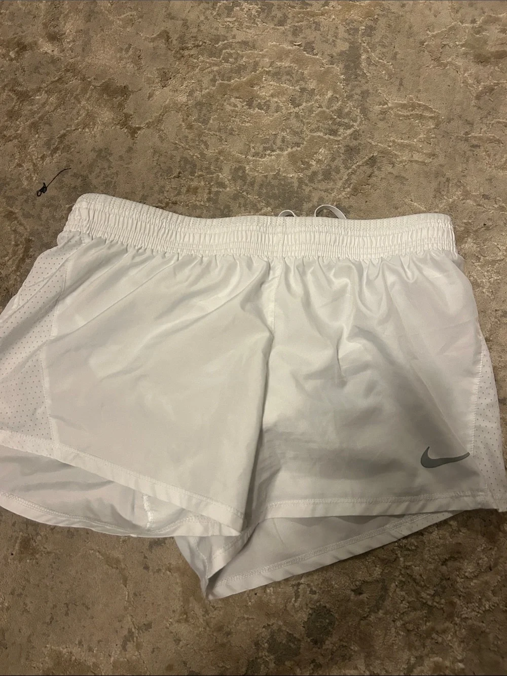 Nike Women's White Athletic Shorts with Silver Swoosh